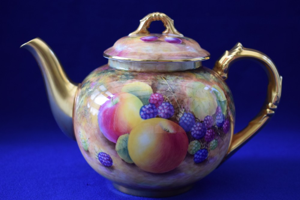 Royal Worcester painted fruit teapot and lid.