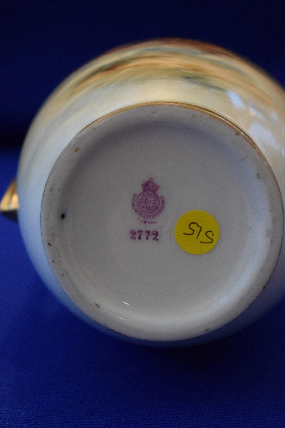 A tall, tapered antique Royal Worcester porcelain vase featuring a hand-painted scene of two sheep in a misty highland landscape with gilded angular side handles. View IV