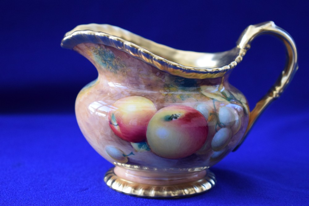 Royal Worcester painted fruit rope edge cream jug.