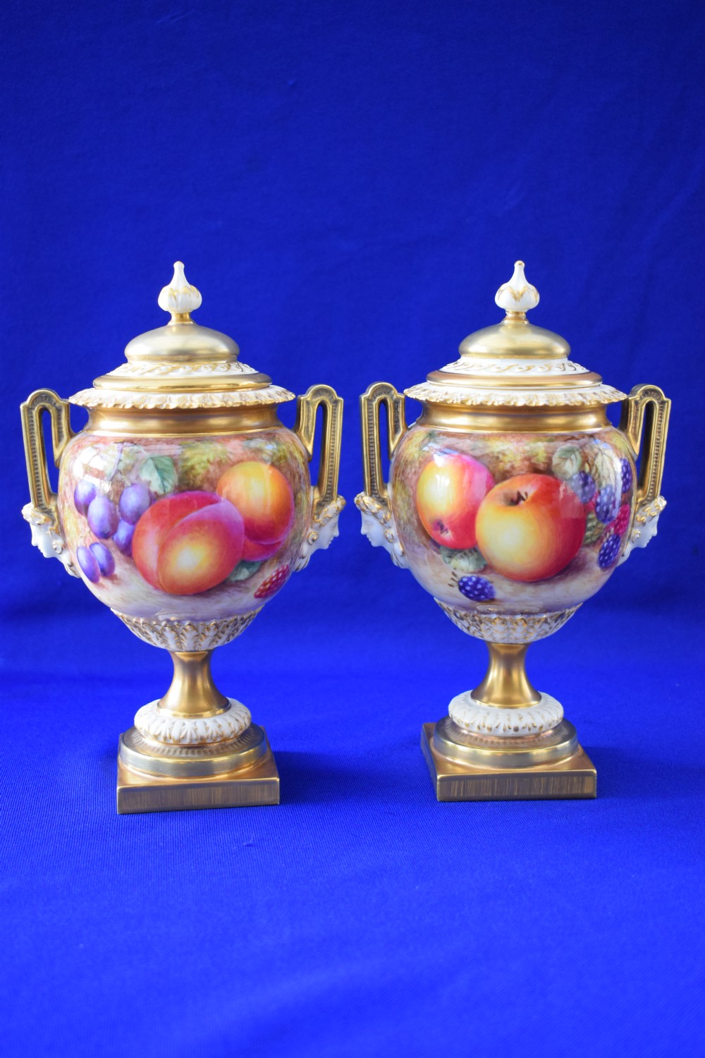 Royal Worcester pair of painted fruit vases and covers by Freeman