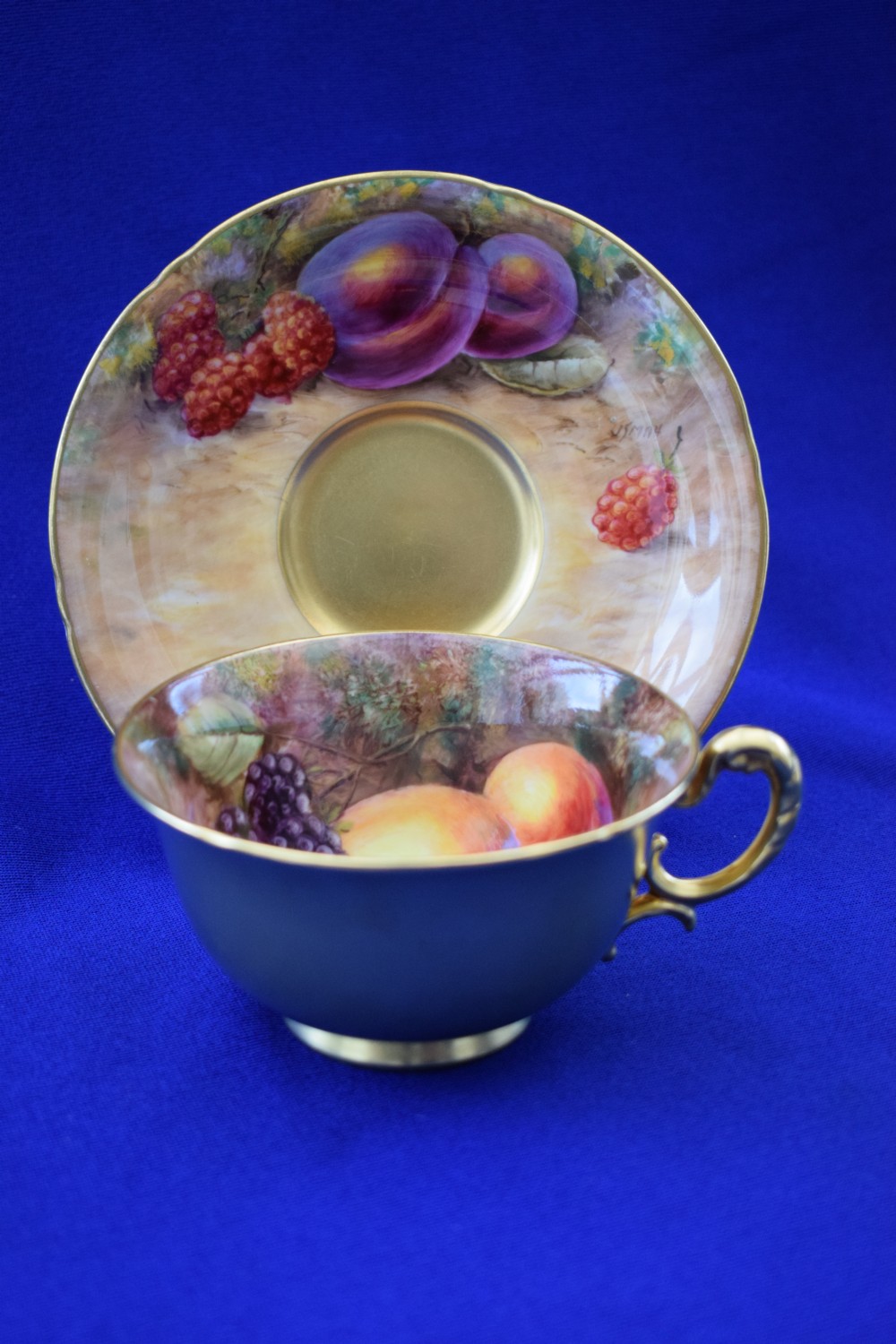 Royal Worcester painted fruit cup and saucer by John Smith