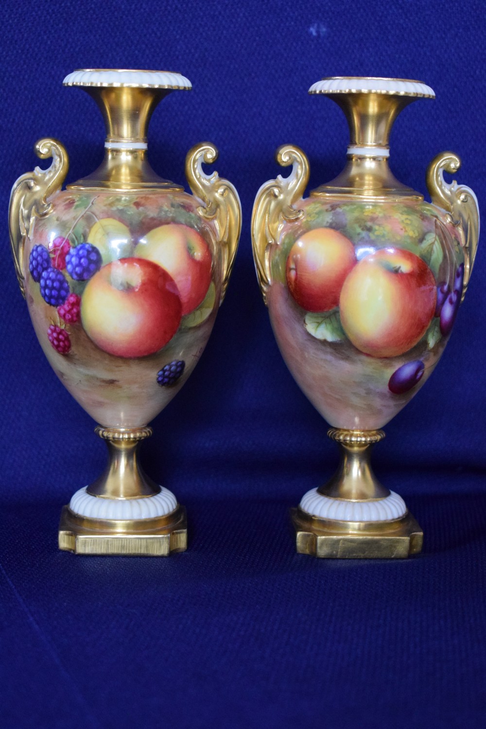 Royal Worcester pair of small painted fruit vases, pink mark