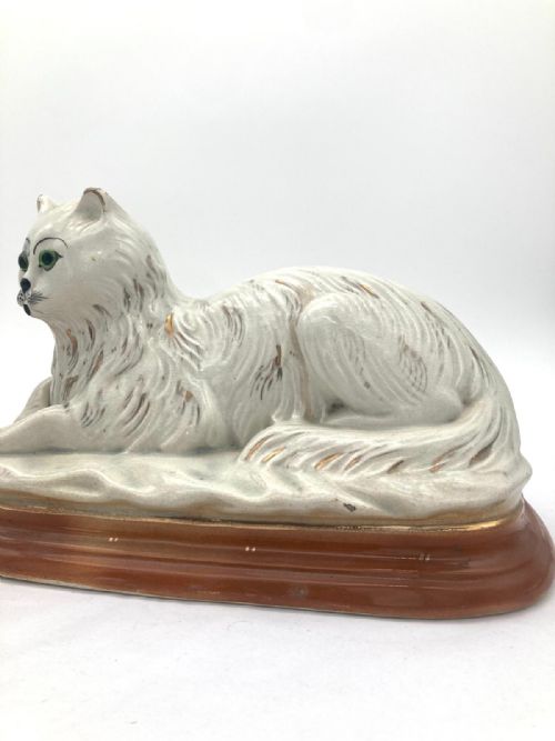 AN UNUSUAL PAIR OF LATE 19TH CENTURY RECUMBENT STAFFORDSHIRE CATS - ADDITIONAL PHOTO 3