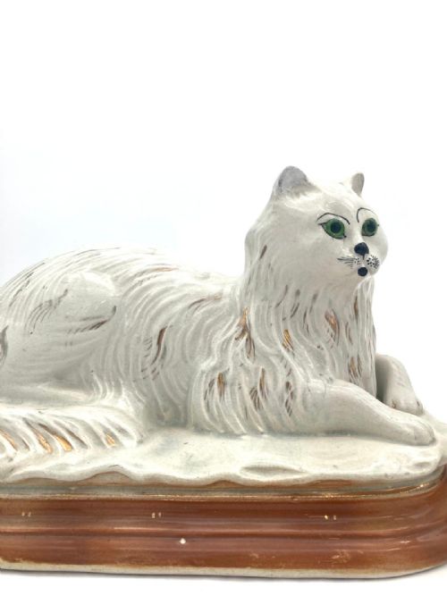 AN UNUSUAL PAIR OF LATE 19TH CENTURY RECUMBENT STAFFORDSHIRE CATS - ADDITIONAL PHOTO 4