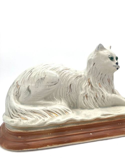 AN UNUSUAL PAIR OF LATE 19TH CENTURY RECUMBENT STAFFORDSHIRE CATS - ADDITIONAL PHOTO 5