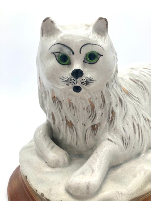 AN UNUSUAL PAIR OF LATE 19TH CENTURY RECUMBENT STAFFORDSHIRE CATS - ADDITIONAL PHOTO 7
