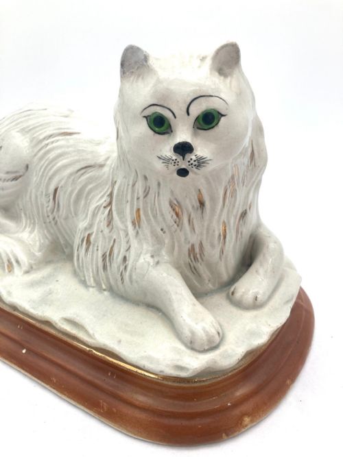AN UNUSUAL PAIR OF LATE 19TH CENTURY RECUMBENT STAFFORDSHIRE CATS - ADDITIONAL PHOTO 8