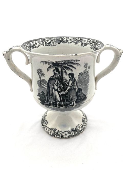 A BLACK TRANSFER PEDESTAL LOVING MUG WITH FROG 1840'S