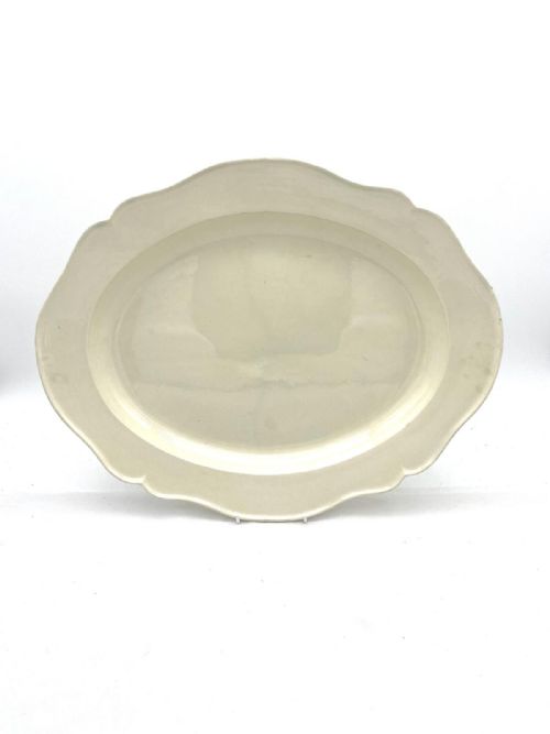 A LARGE SILVER SHAPED CREAMWARE CHARGER CIRCA 1770