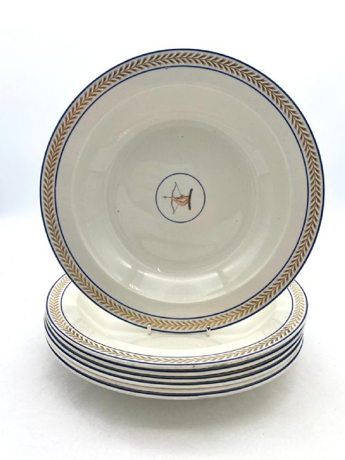 A SET OF SEVEN WEDGWOOD ARMORIAL CREAMWARE SOUP BOWLS