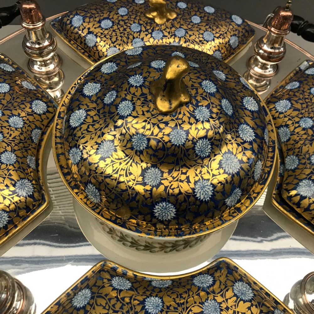 An early 19th-century Coalport porcelain supper set featuring cobalt blue and gold floral pattern covered dishes and condiment shakers set on a revolving silver-plated tray with dark wood handles. View III