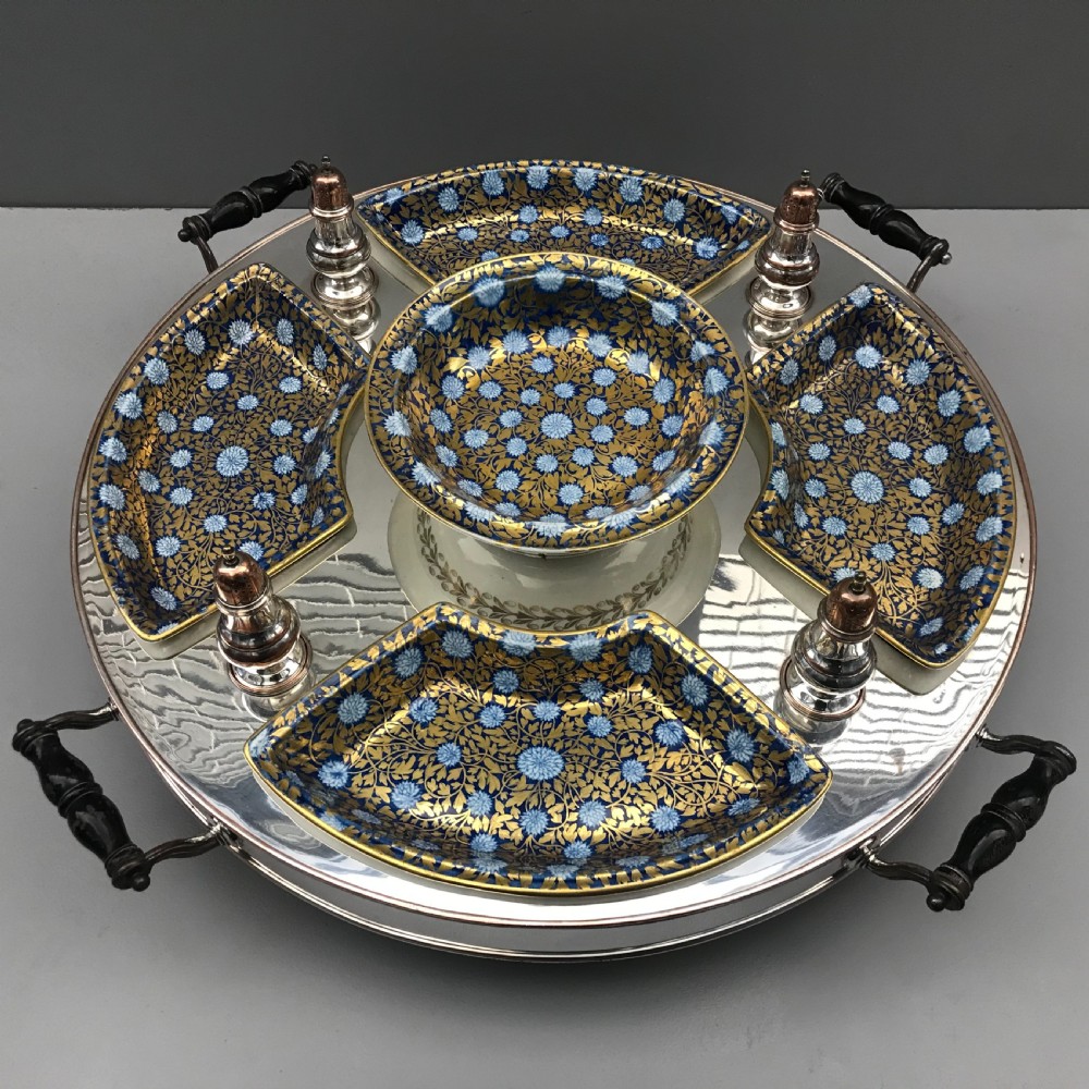 An early 19th-century Coalport porcelain supper set featuring cobalt blue and gold floral pattern covered dishes and condiment shakers set on a revolving silver-plated tray with dark wood handles. View IV