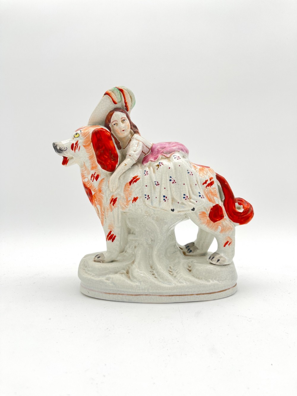 A Rare Staffordshire Pottery Royal Child on a St. Bernard. 1860-70