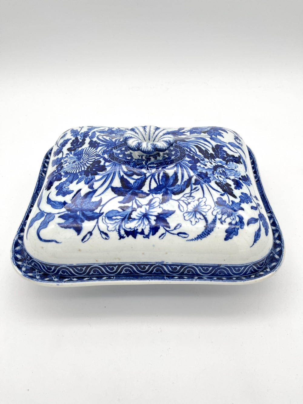 An extensive blue and white transfer-printed Wedgwood earthenware dinner service in the Hibiscus pattern featuring plates, serving dishes, and a covered tureen. View VII