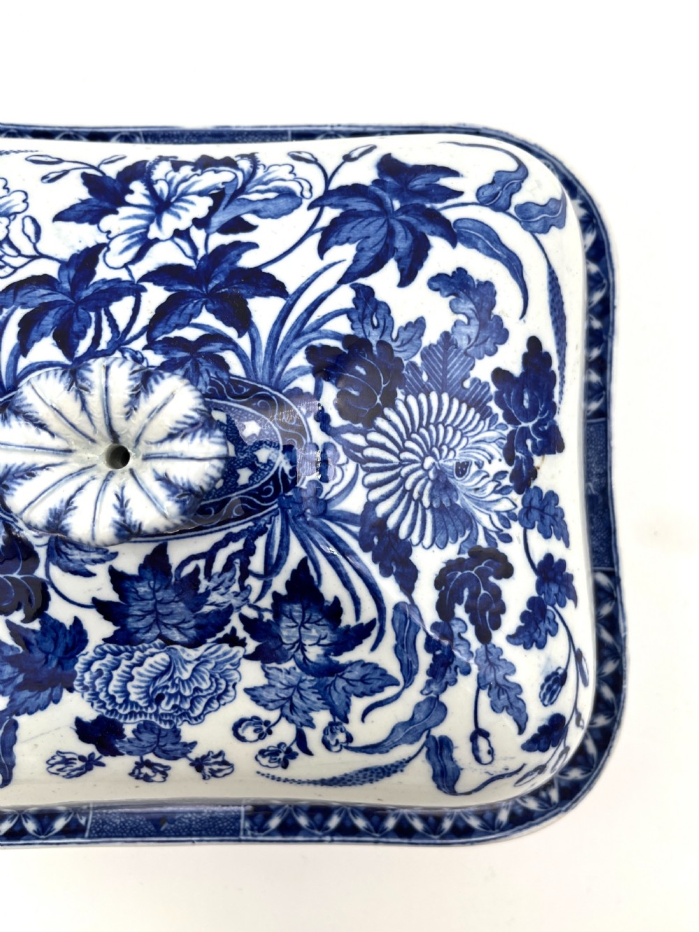 An extensive blue and white transfer-printed Wedgwood earthenware dinner service in the Hibiscus pattern featuring plates, serving dishes, and a covered tureen. View X