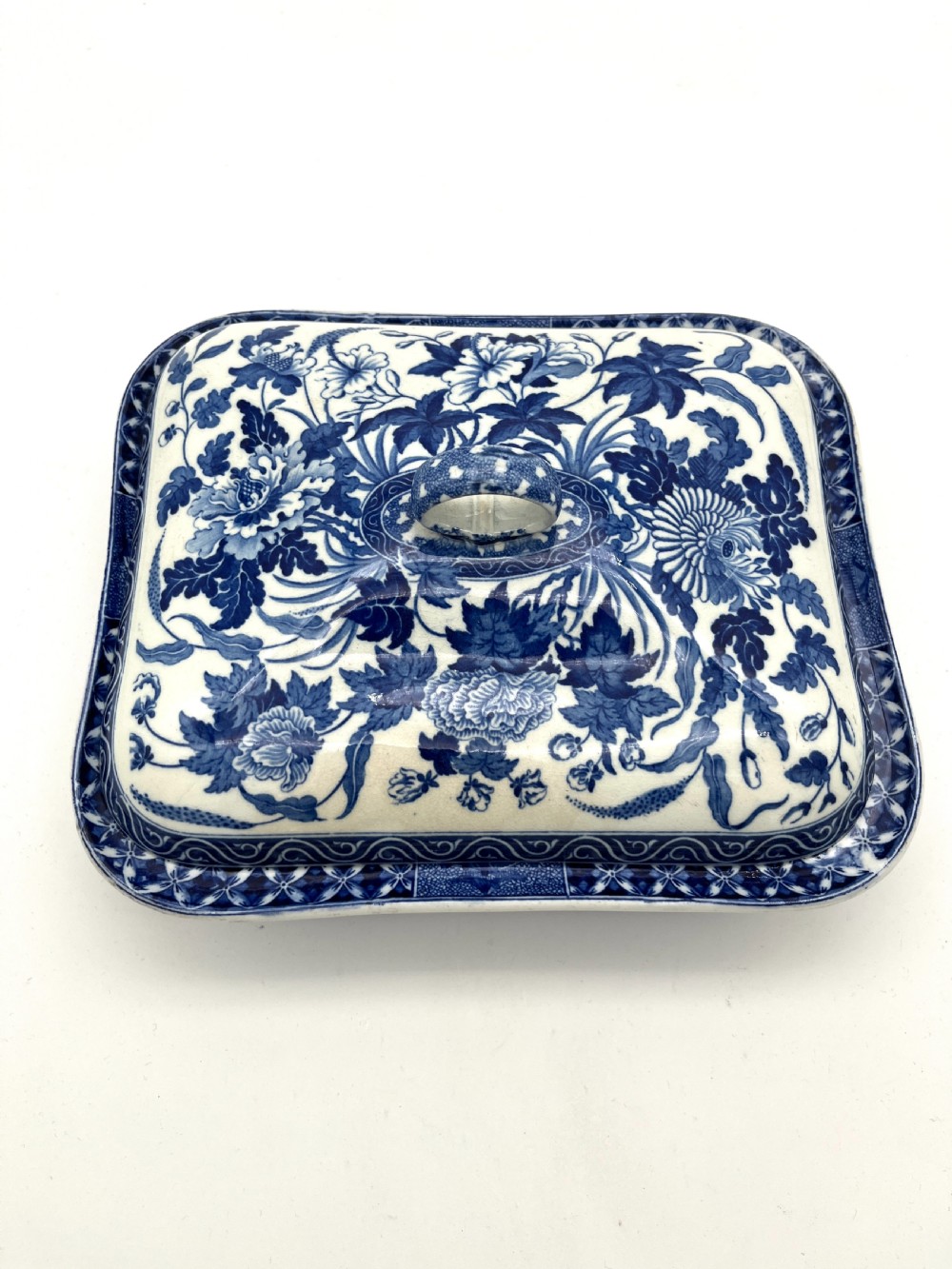 An extensive blue and white transfer-printed Wedgwood earthenware dinner service in the Hibiscus pattern featuring plates, serving dishes, and a covered tureen. View XI