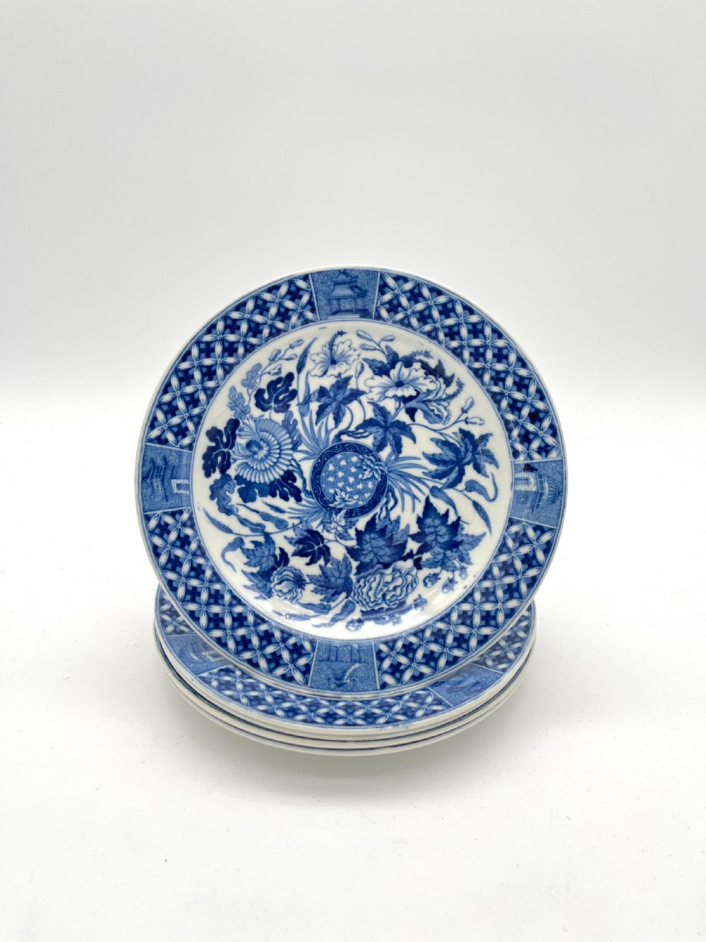 An extensive blue and white transfer-printed Wedgwood earthenware dinner service in the Hibiscus pattern featuring plates, serving dishes, and a covered tureen. View XIII