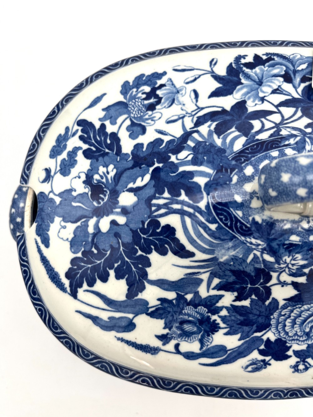 An extensive blue and white transfer-printed Wedgwood earthenware dinner service in the Hibiscus pattern featuring plates, serving dishes, and a covered tureen. View XVIII