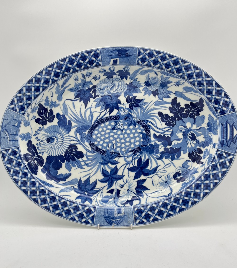 An extensive blue and white transfer-printed Wedgwood earthenware dinner service in the Hibiscus pattern featuring plates, serving dishes, and a covered tureen. View XX