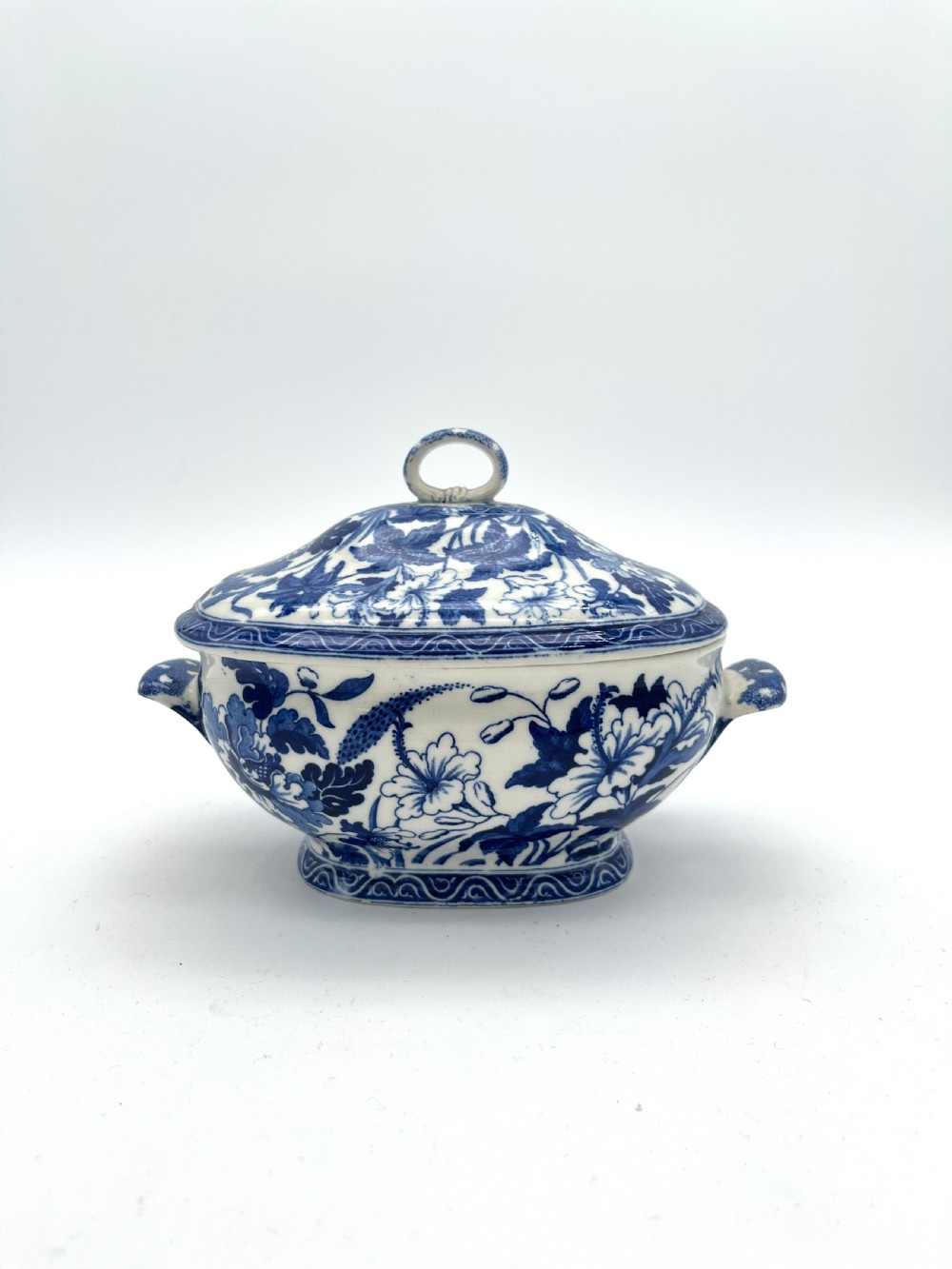 An extensive blue and white transfer-printed Wedgwood earthenware dinner service in the Hibiscus pattern featuring plates, serving dishes, and a covered tureen. View XXI