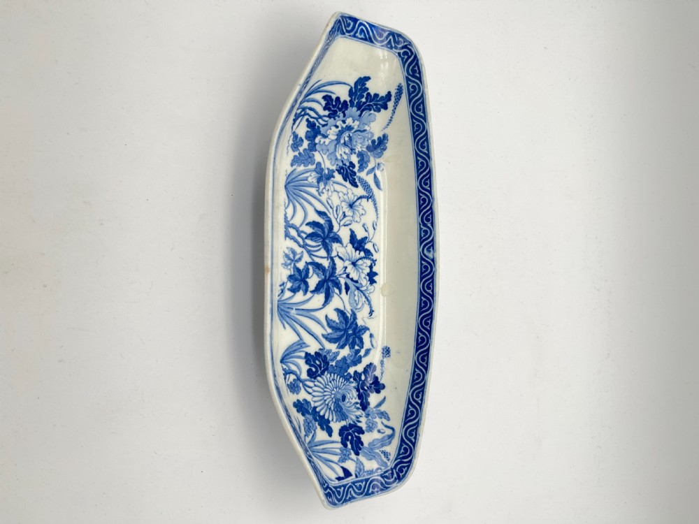 An extensive blue and white transfer-printed Wedgwood earthenware dinner service in the Hibiscus pattern featuring plates, serving dishes, and a covered tureen. View XXIII