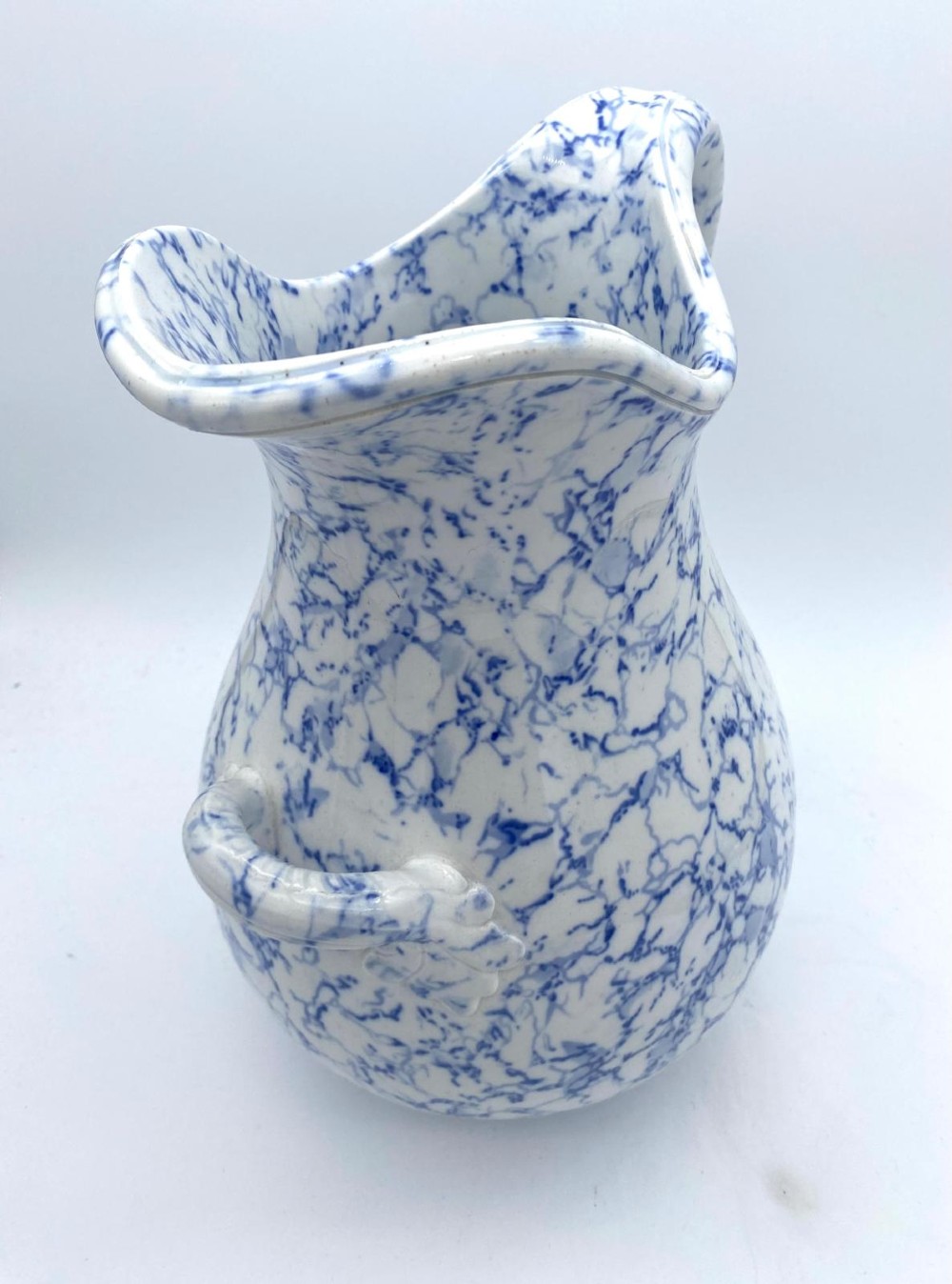 A mid-nineteenth-century Minton ceramic footbath and matching jug featuring a blue and white Italian marble transfer printed pattern. View X