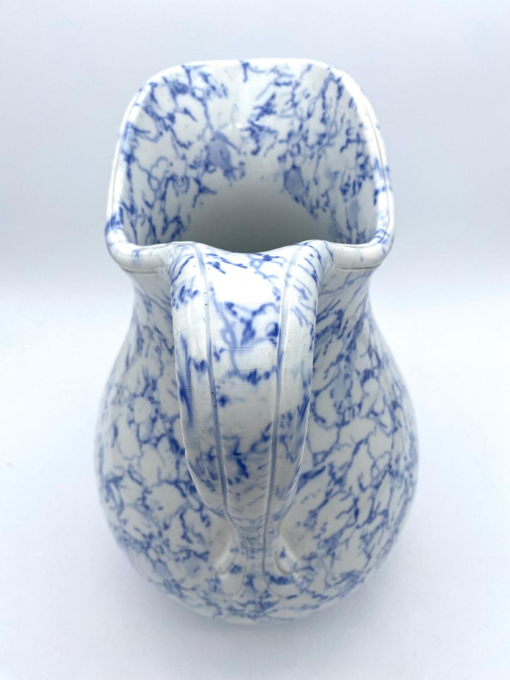 A mid-nineteenth-century Minton ceramic footbath and matching jug featuring a blue and white Italian marble transfer printed pattern. View XIII
