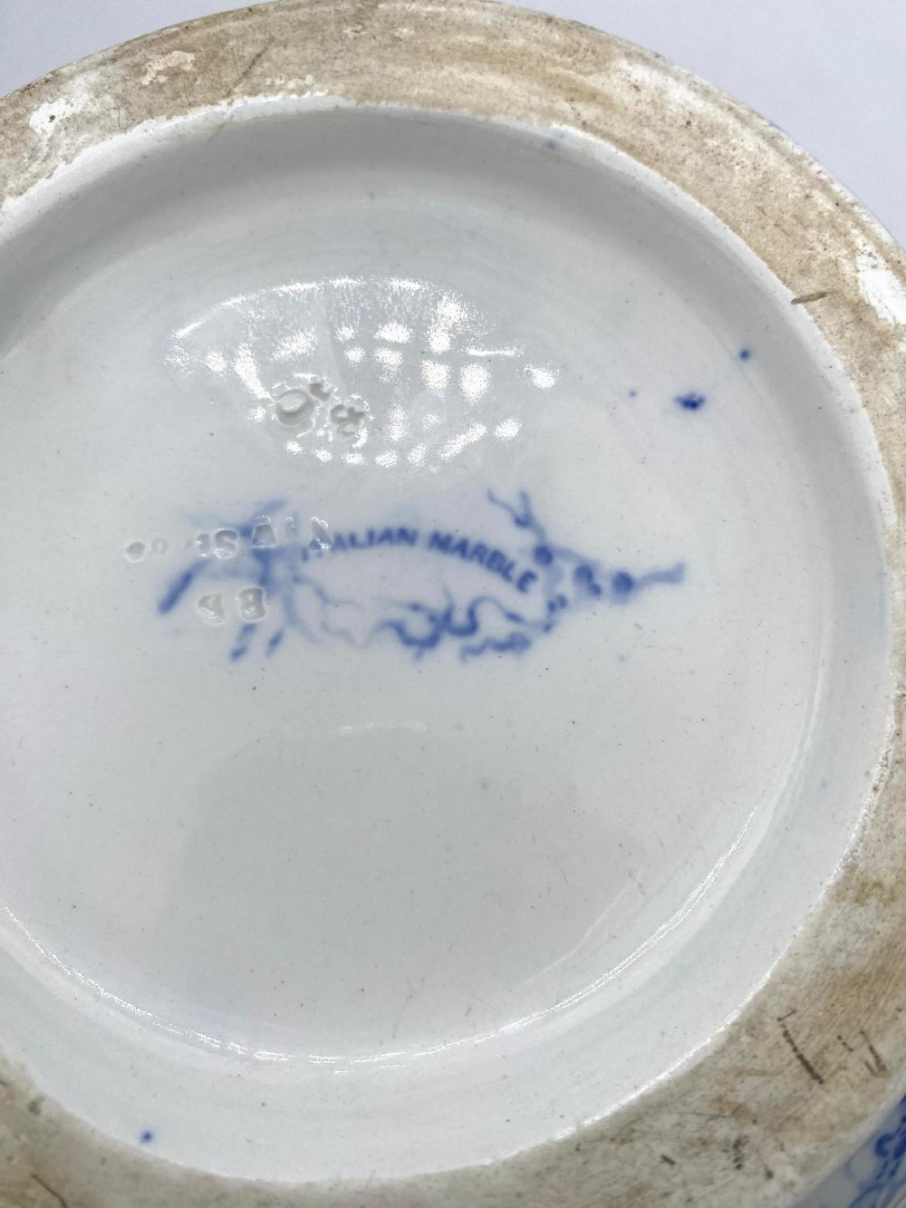 A mid-nineteenth-century Minton ceramic footbath and matching jug featuring a blue and white Italian marble transfer printed pattern. View XV