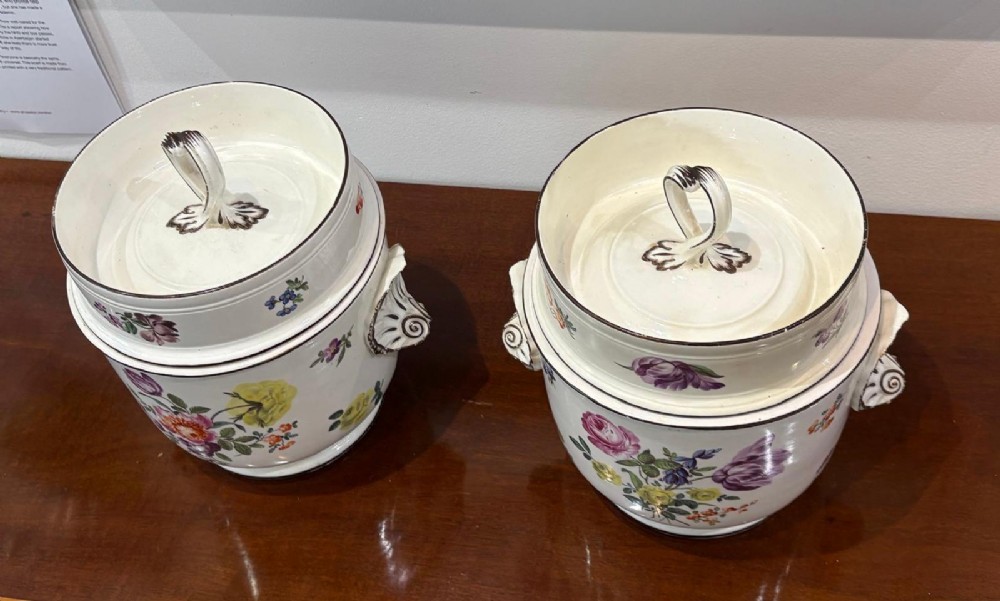 A pair of Georgian creamware ice pails decorated with hand-painted botanical flowers, featuring side scroll handles and tiered lids. View III