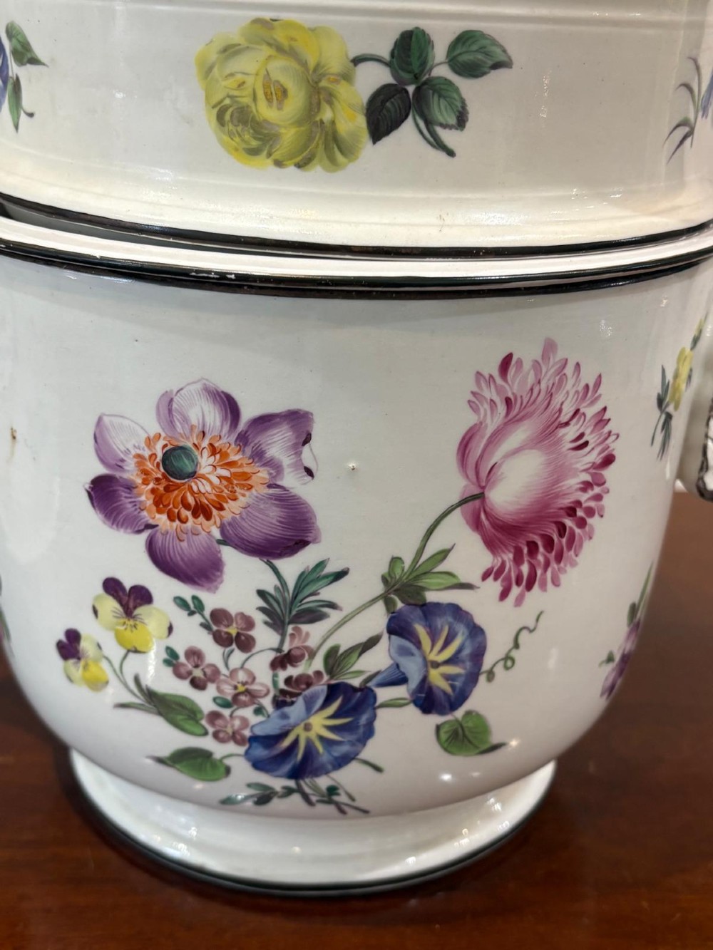 A pair of Georgian creamware ice pails decorated with hand-painted botanical flowers, featuring side scroll handles and tiered lids. View VII