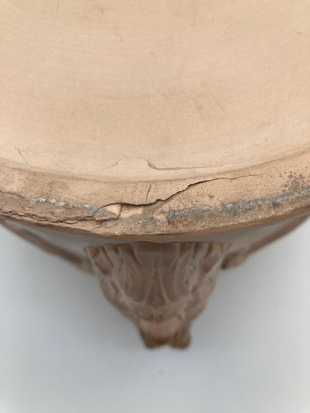 An unglazed terracotta wine cooler featuring twin scroll handles, a basketweave collar, and relief-moulded grape and vine leaf motifs. View XIV