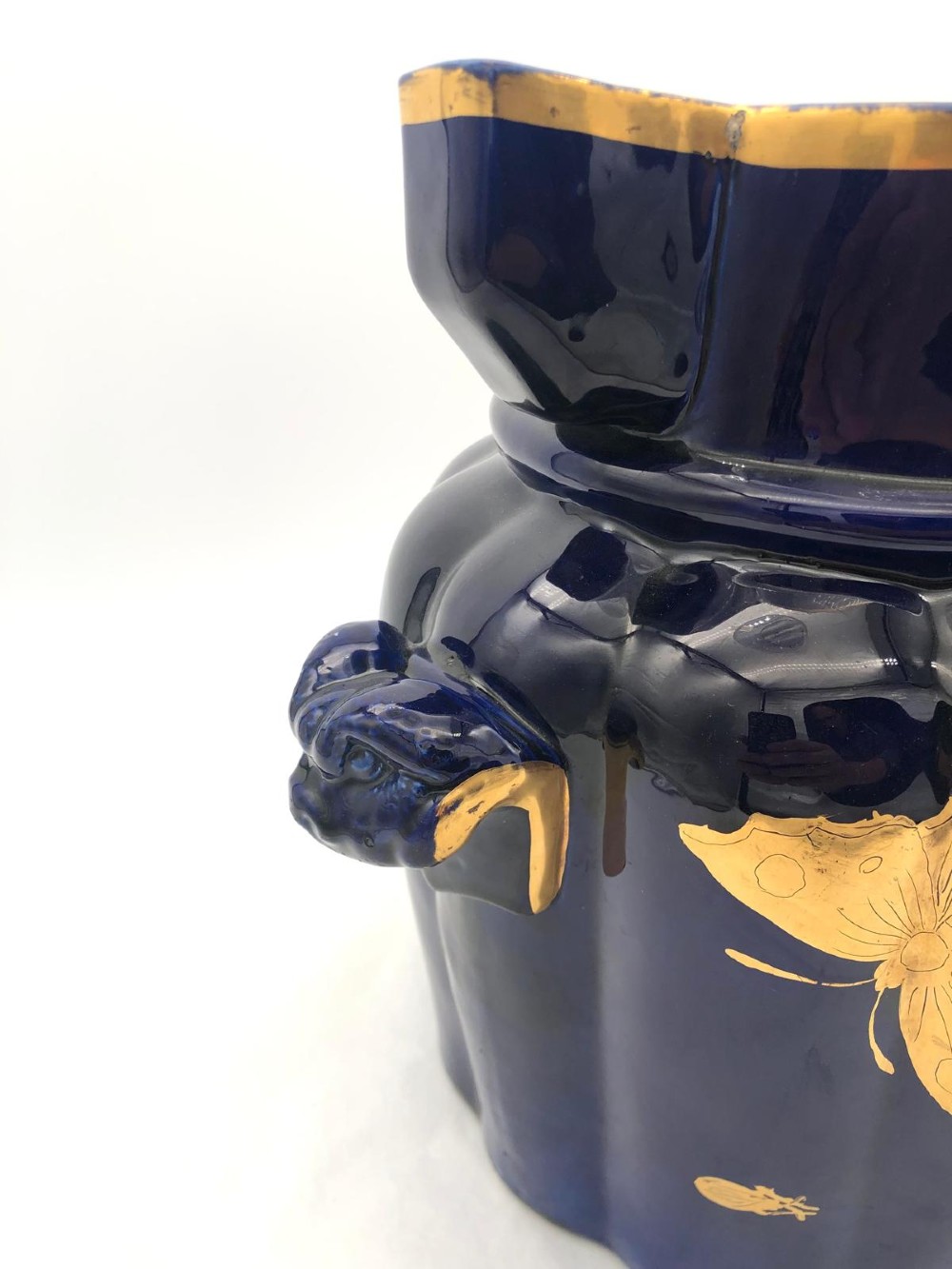 A deep cobalt blue porcelain jug decorated with gilded butterfly motifs and a wide spout, dating to circa 1820. View VII