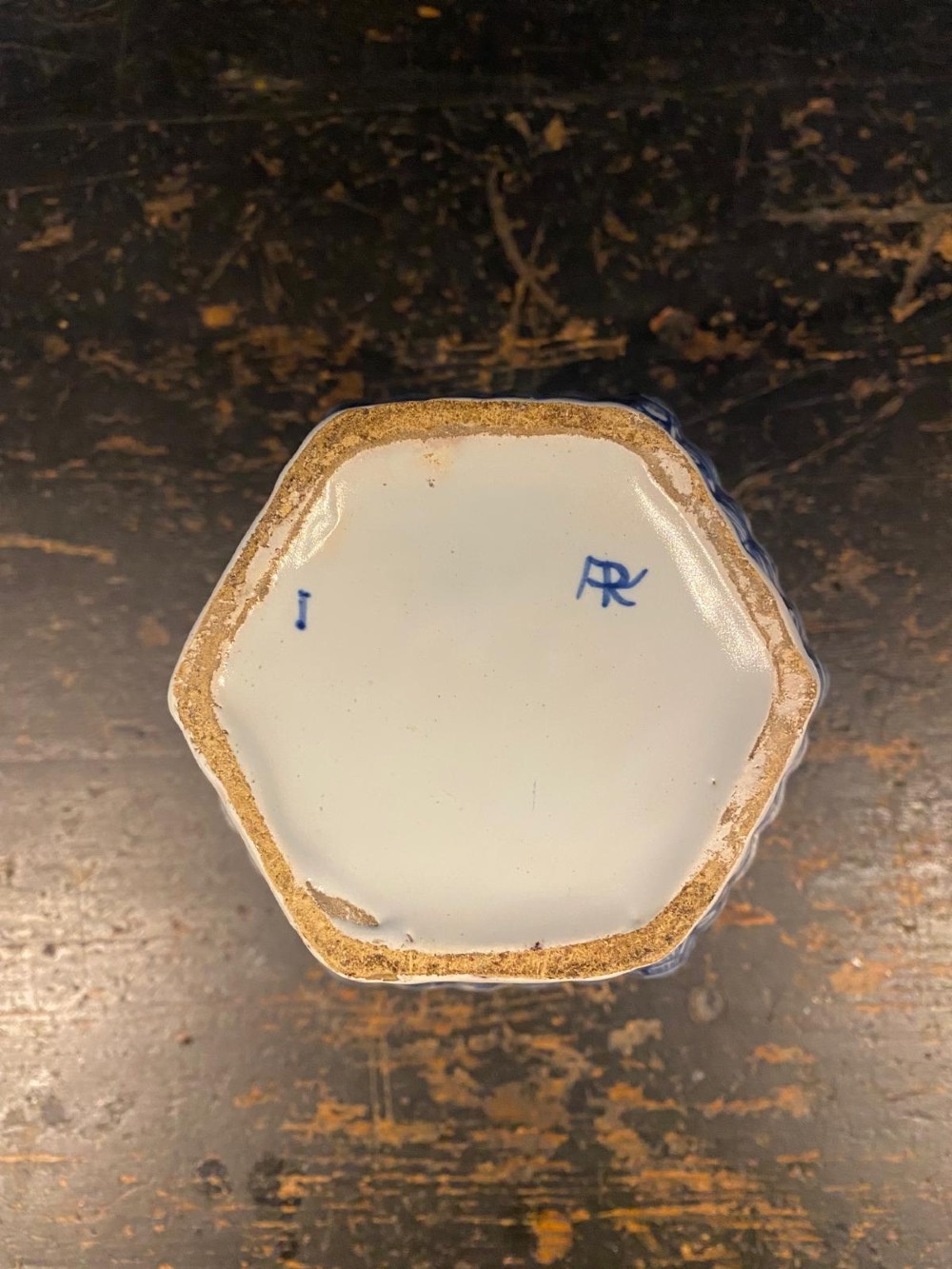 A pair of octagonal blue and white tin-glazed earthenware lidded vases decorated with hand-painted chinoiserie scenes and animal finials. View XV
