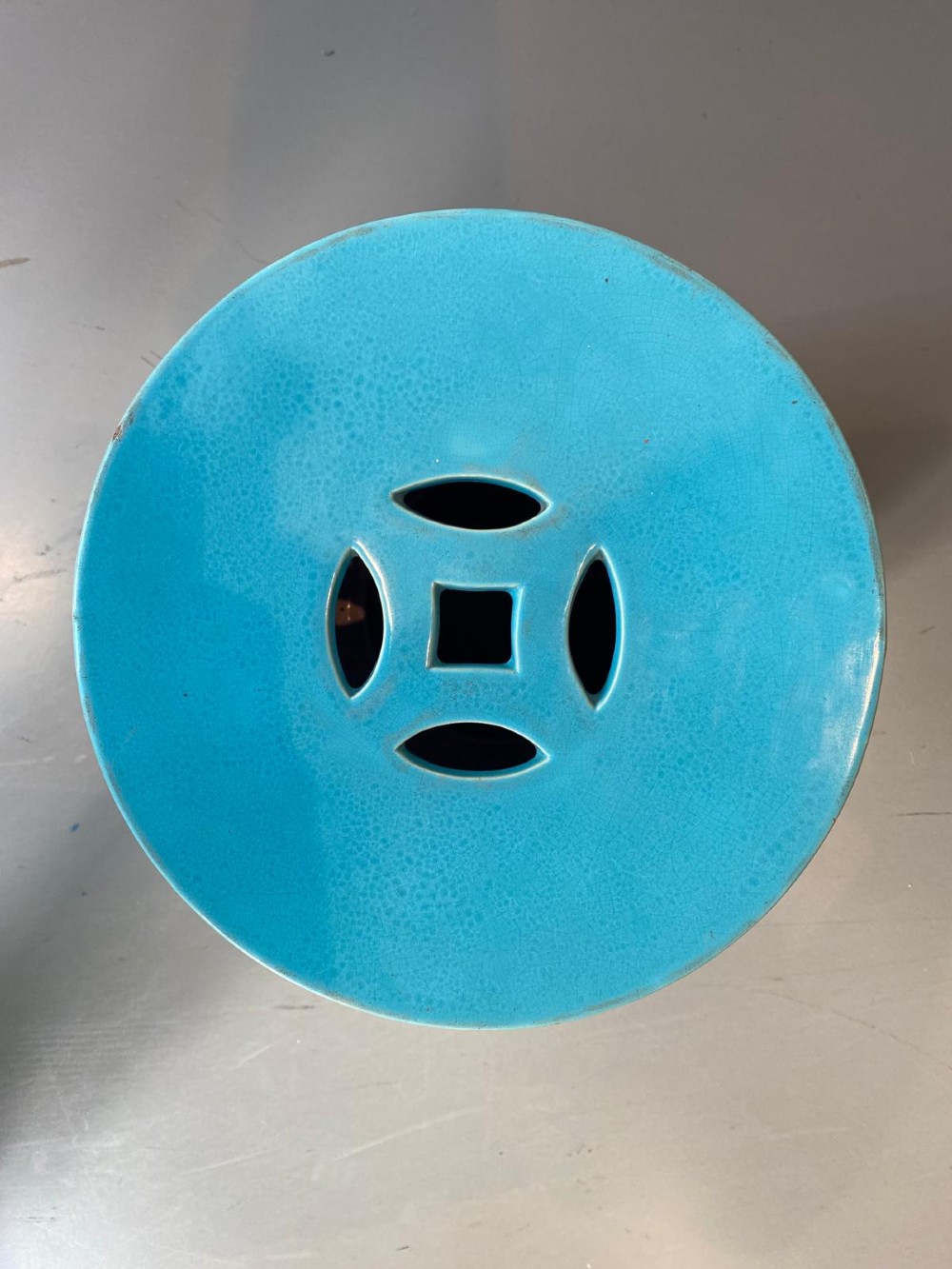 A vibrant turquoise glazed majolica ceramic barrel-shaped garden seat with raised stud detailing and pierced geometric openings. View III