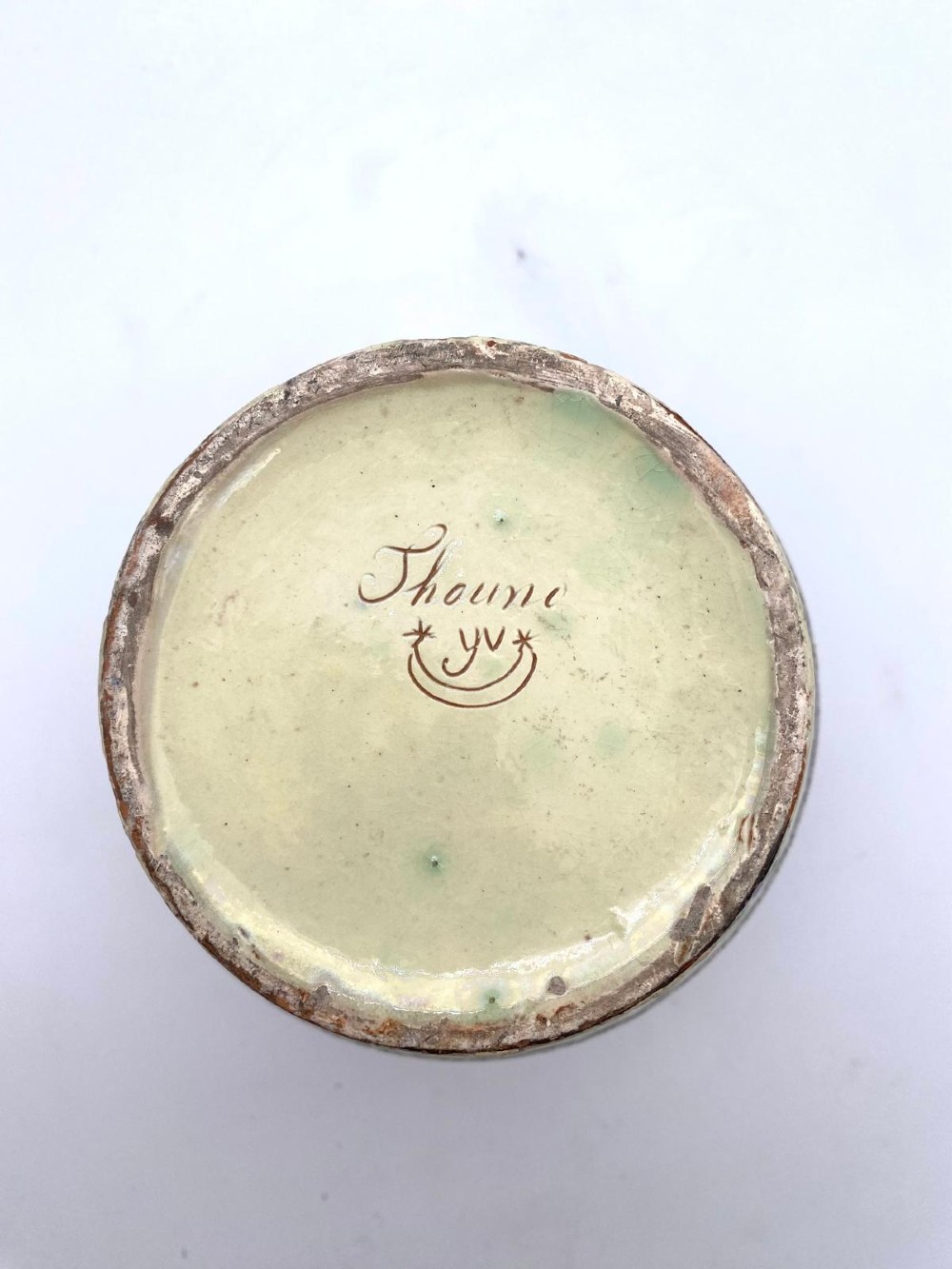 A late 19th-century bulbous Thoune earthenware vase decorated with hand-painted floral slipware motifs in terracotta, blue, and green over a cream background. View VI