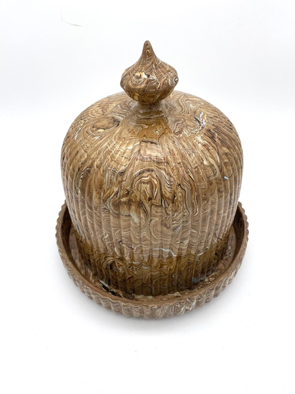 An early Victorian Staffordshire agateware cheese dome and matching base dish featuring a marbled brown swirled glaze with vertical fluting and a pointed finial. View II