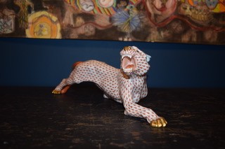 A hand-painted orange fishnet patterned porcelain jaguar sculpture in a prowling stance with gold paws and snout. View V