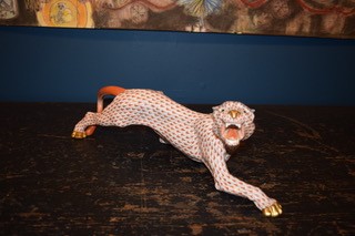 A hand-painted orange fishnet patterned porcelain jaguar sculpture in a prowling stance with gold paws and snout. View VI