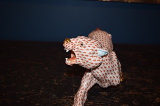 A hand-painted orange fishnet patterned porcelain jaguar sculpture in a prowling stance with gold paws and snout. View XI