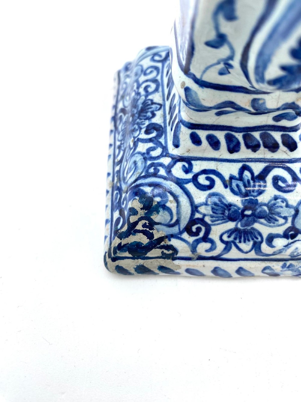 A pair of blue and white heart-shaped ceramic tulipieres featuring multiple spouts and hand-painted Dutch figures in landscape settings. View VIII