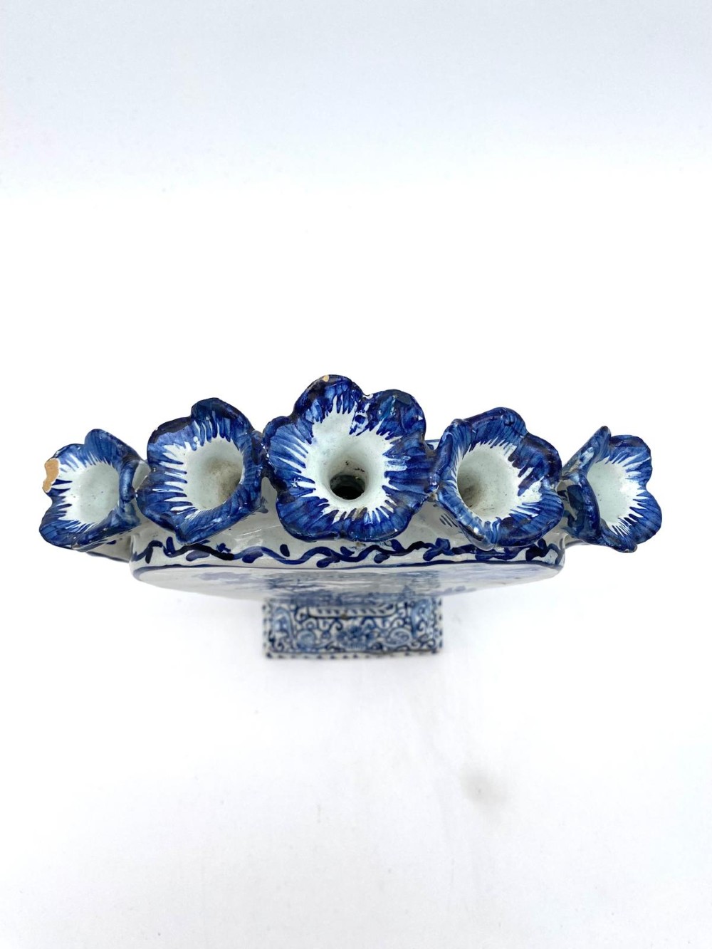 A pair of blue and white heart-shaped ceramic tulipieres featuring multiple spouts and hand-painted Dutch figures in landscape settings. View XI