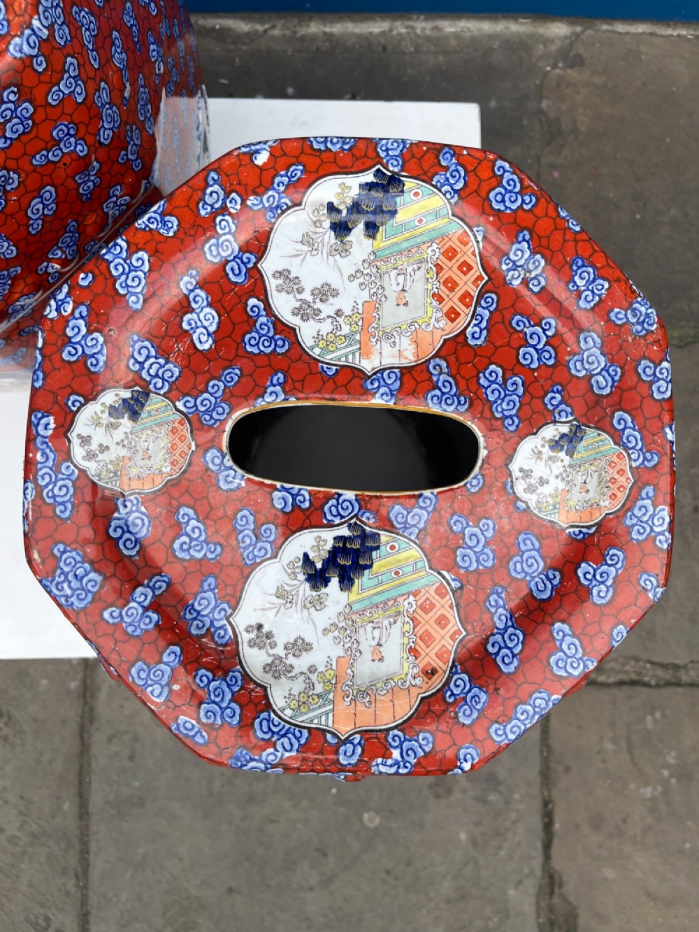 A pair of barrel-shaped clobbered ironstone garden seats decorated with a vibrant red and blue cloud pattern surrounding pictorial panels. View IV