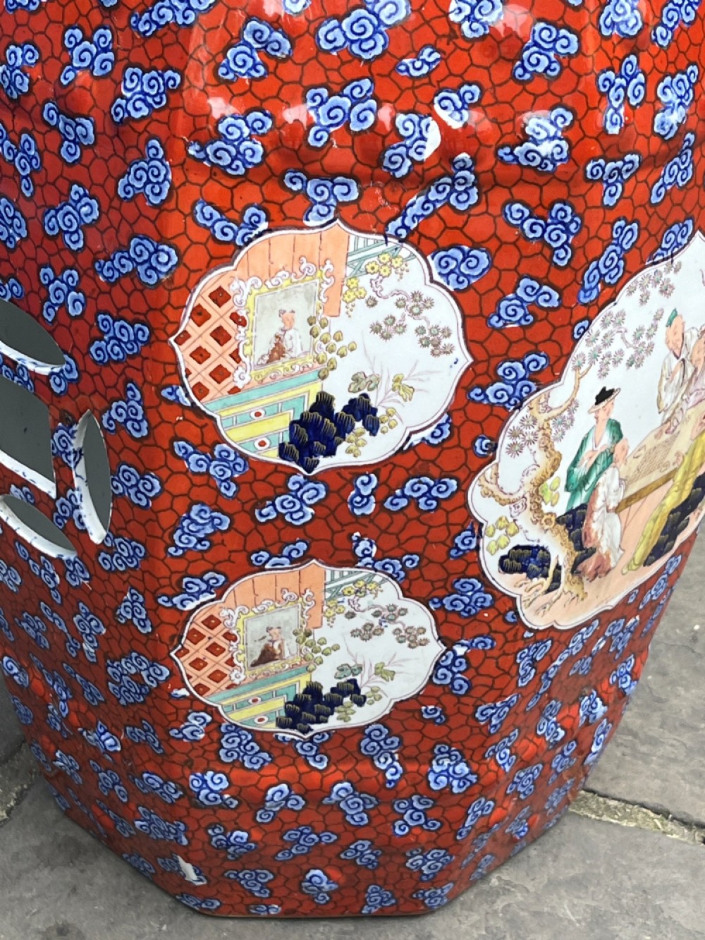 A pair of barrel-shaped clobbered ironstone garden seats decorated with a vibrant red and blue cloud pattern surrounding pictorial panels. View VIII