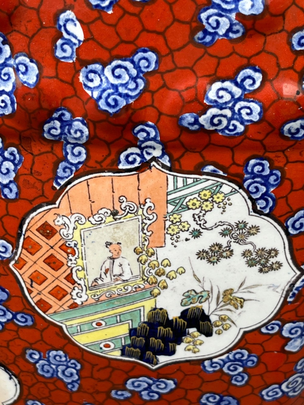 A pair of barrel-shaped clobbered ironstone garden seats decorated with a vibrant red and blue cloud pattern surrounding pictorial panels. View IX