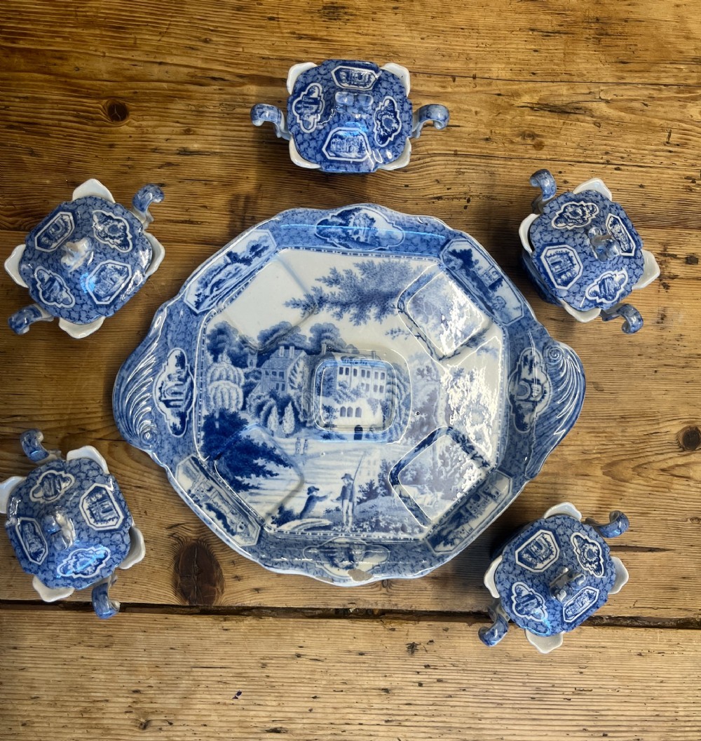 A nineteenth-century blue and white English transferware custard set featuring lidded pots arranged on a matching shaped tray. View V