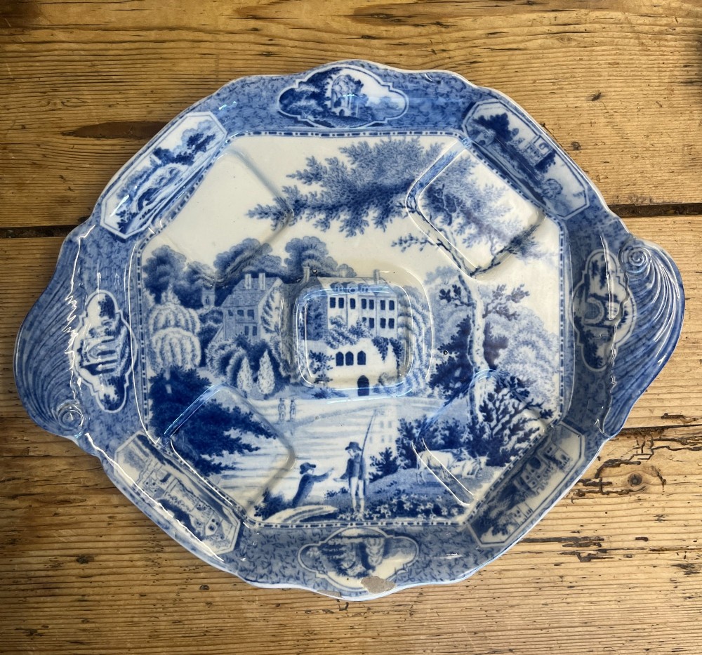 A nineteenth-century blue and white English transferware custard set featuring lidded pots arranged on a matching shaped tray. View VI