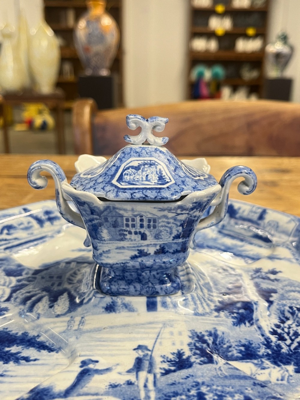 A nineteenth-century blue and white English transferware custard set featuring lidded pots arranged on a matching shaped tray. View VIII