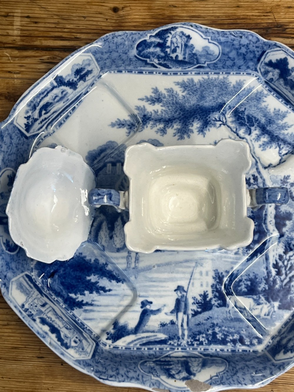 A nineteenth-century blue and white English transferware custard set featuring lidded pots arranged on a matching shaped tray. View X