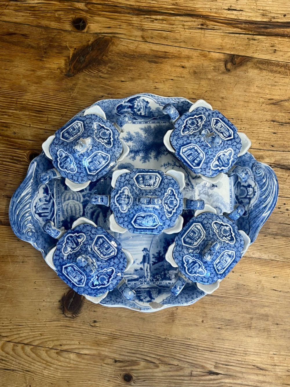 A nineteenth-century blue and white English transferware custard set featuring lidded pots arranged on a matching shaped tray. View XIII