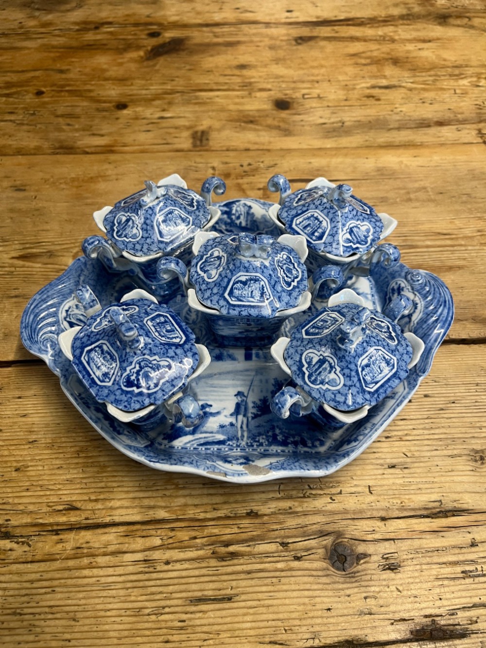 A nineteenth-century blue and white English transferware custard set featuring lidded pots arranged on a matching shaped tray. View XIV